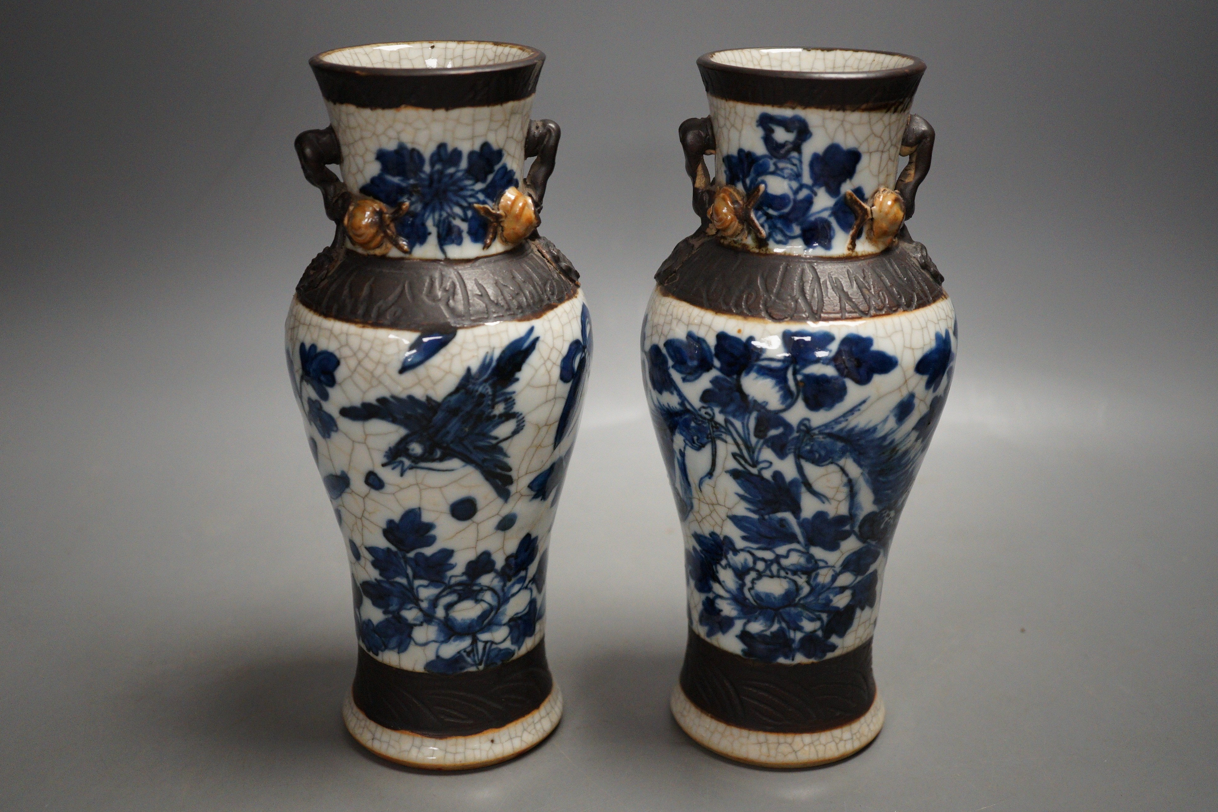 A pair of late 19th century Chinese blue and white crackle glaze vases, 21cm